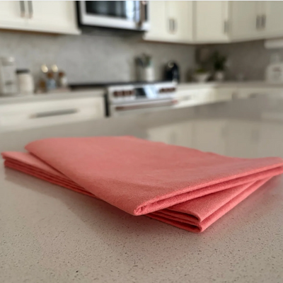 Pink cloth on a kitchen counter with blurred background
