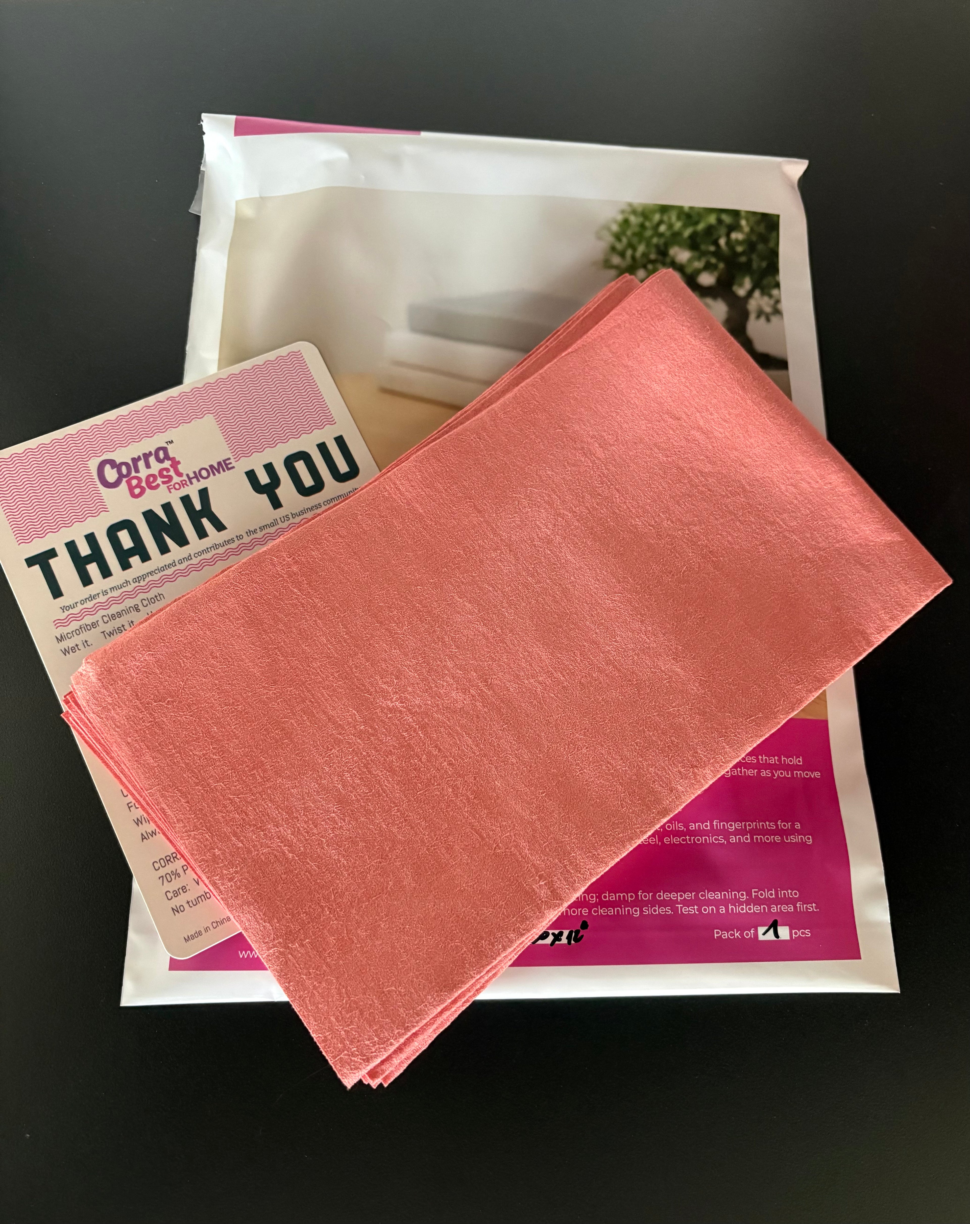 Pink cloth on top of a Corra Get Home package with a 'Thank You' card.