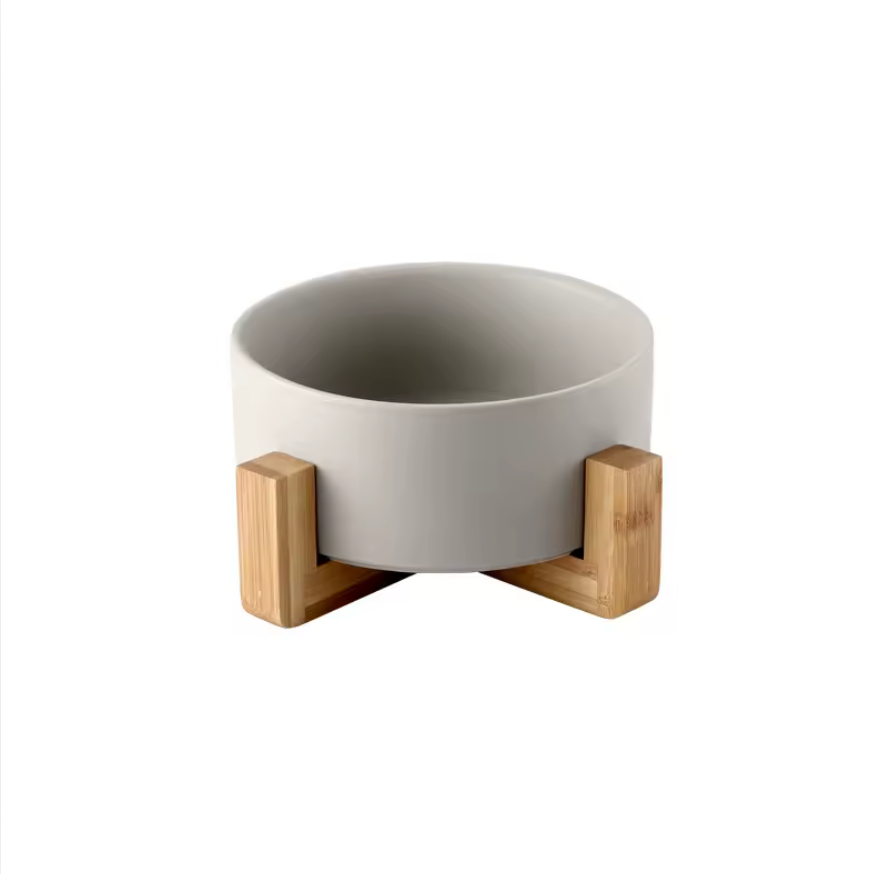White ceramic bowl with wooden stands on a white background