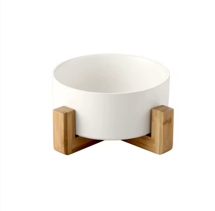 White bowl with wooden holder on a white background